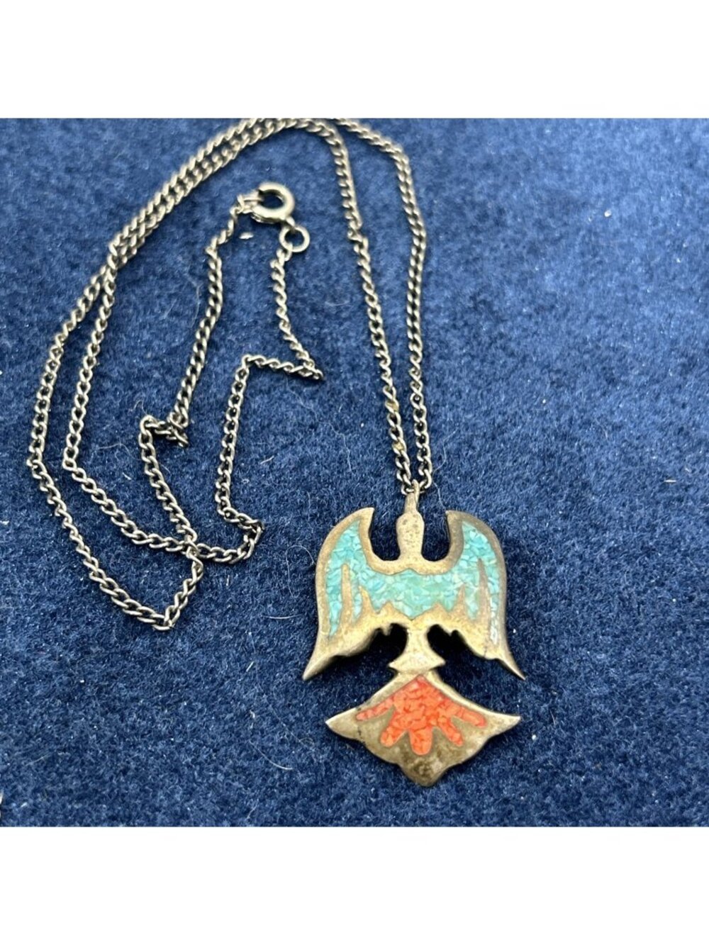 pendant necklace features a classic thunderbird or peyote bird Silver Toned